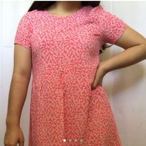 Pink dress with a white floral pattern